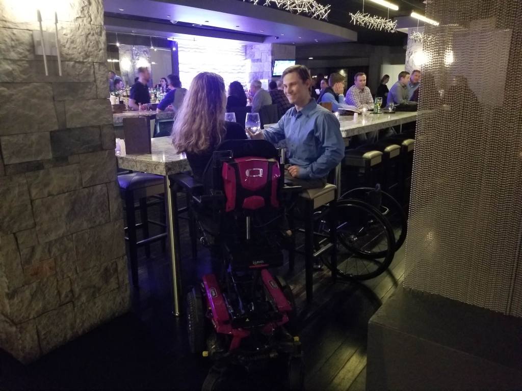 iLevel on a power wheelchair provides greater access to restaurants with high-top tables and the bar