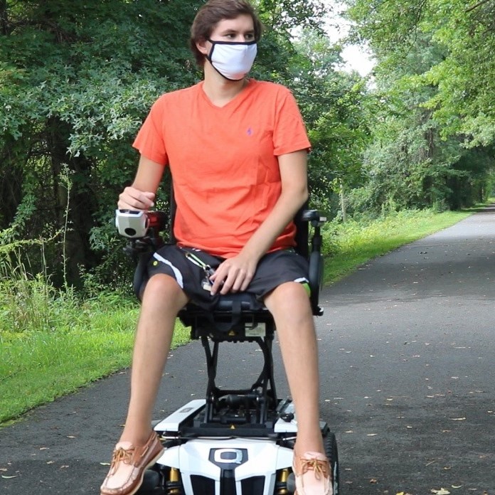 Josh in his Quantum power wheelchair
