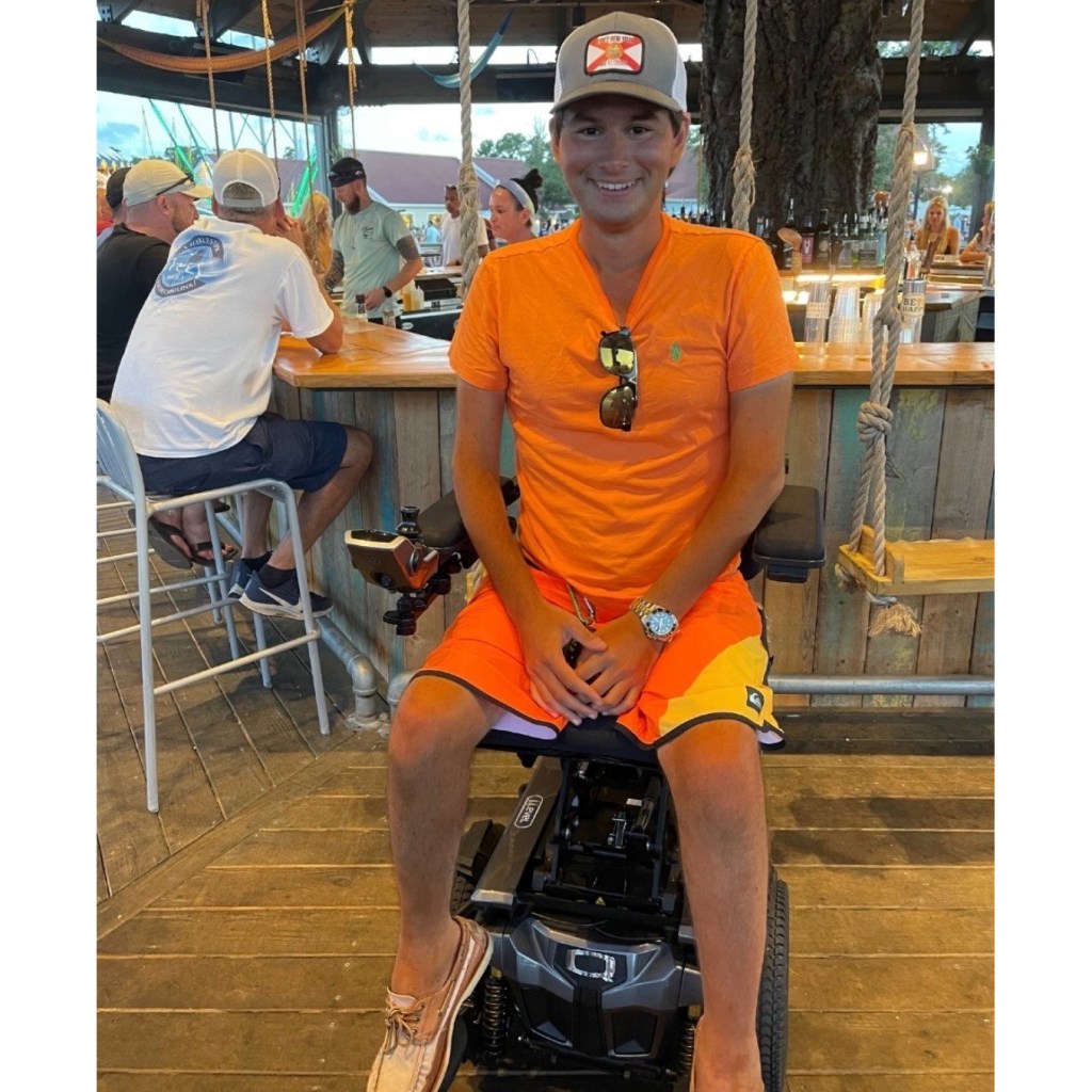 Josh elevated at iLevel in his Quantum Rehab Wheelchair