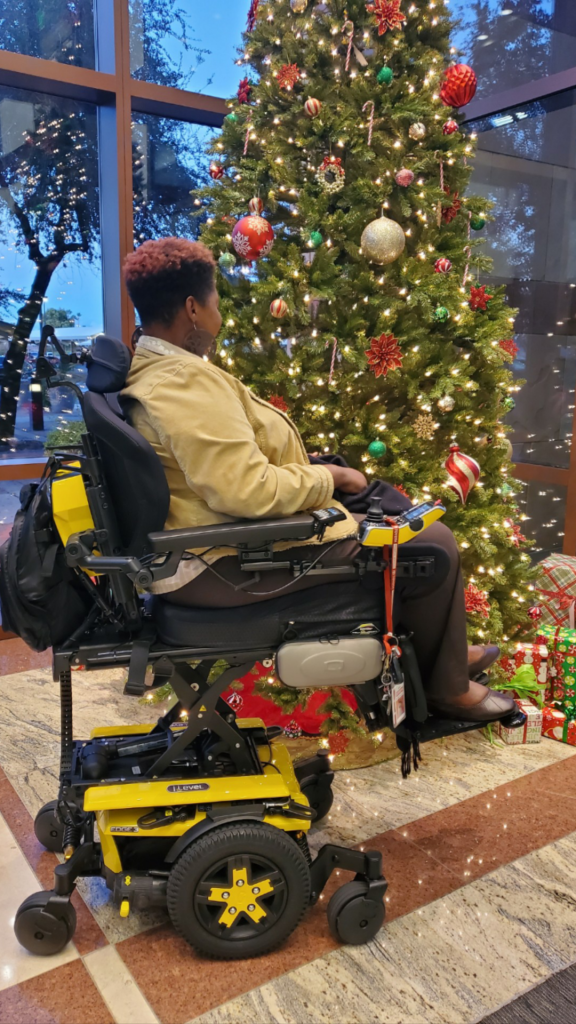 Merlisha loves to decorate with the help of her Quantum Wheelchair with iLevel