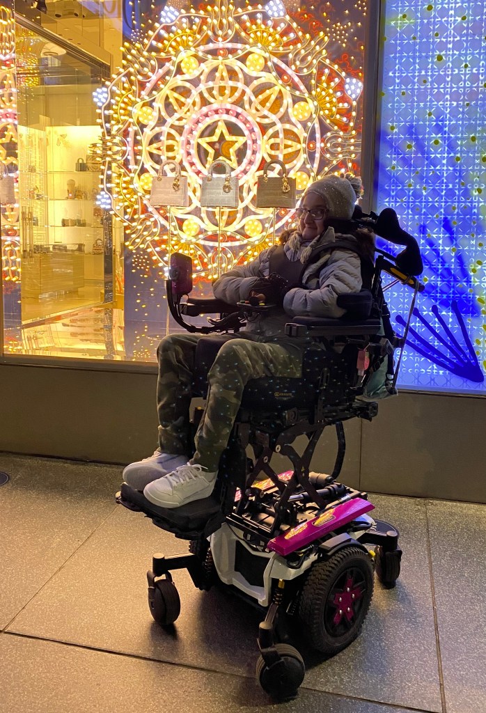 Sakina in her Quantum power wheelchair