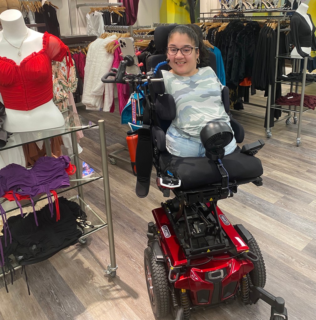 Zoe uses iLevel on her Quantum Power Wheelchair when shopping