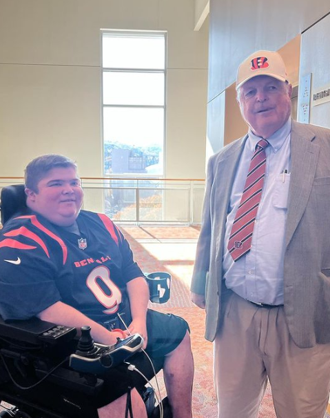 Bryson in his Quantum power wheelchair meets the Bengals' owner Mike Brown
