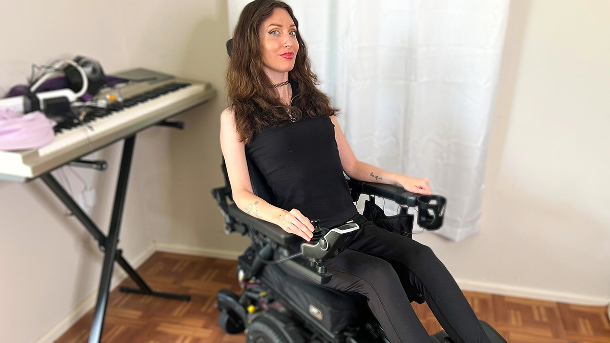 Anomie in her Quantum power wheelchair