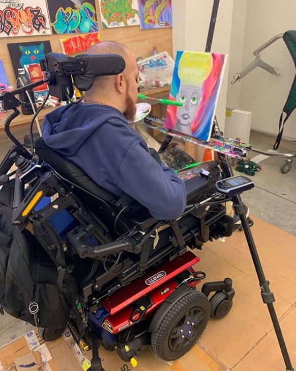 Jesse is a quadriplegic and uses his mouth to paint art