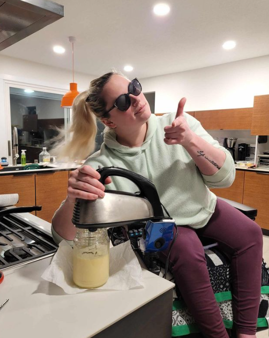 Jim uses seat elevation on her Quantum Power Wheelchair to reach things