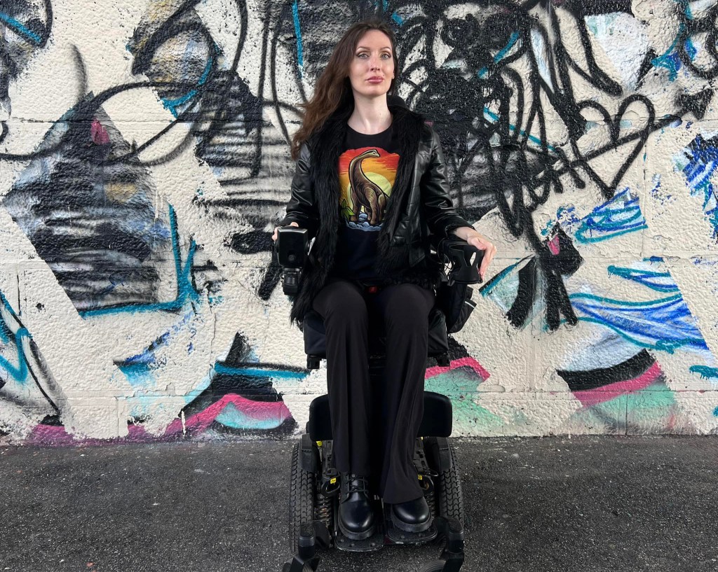 Anomie travels around Philadelphia with her power chair