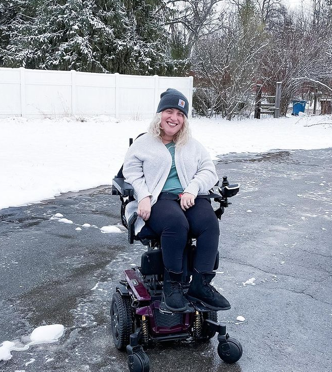 Izzie in her Quantum Rehab power chair